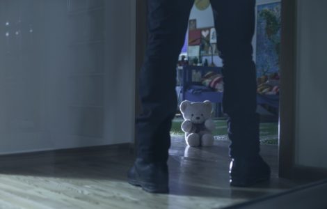 Picture of pedophile standing at the child room entry