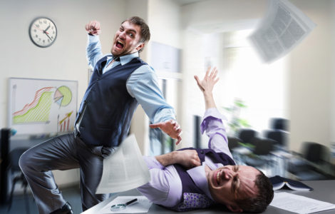 Two agressive businessmen fighting in the office